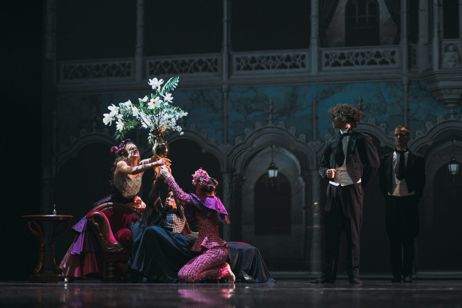 Three dancers of Junior Ballet Antwerp holding a vase with a plant during a scene from CINDERELLA.